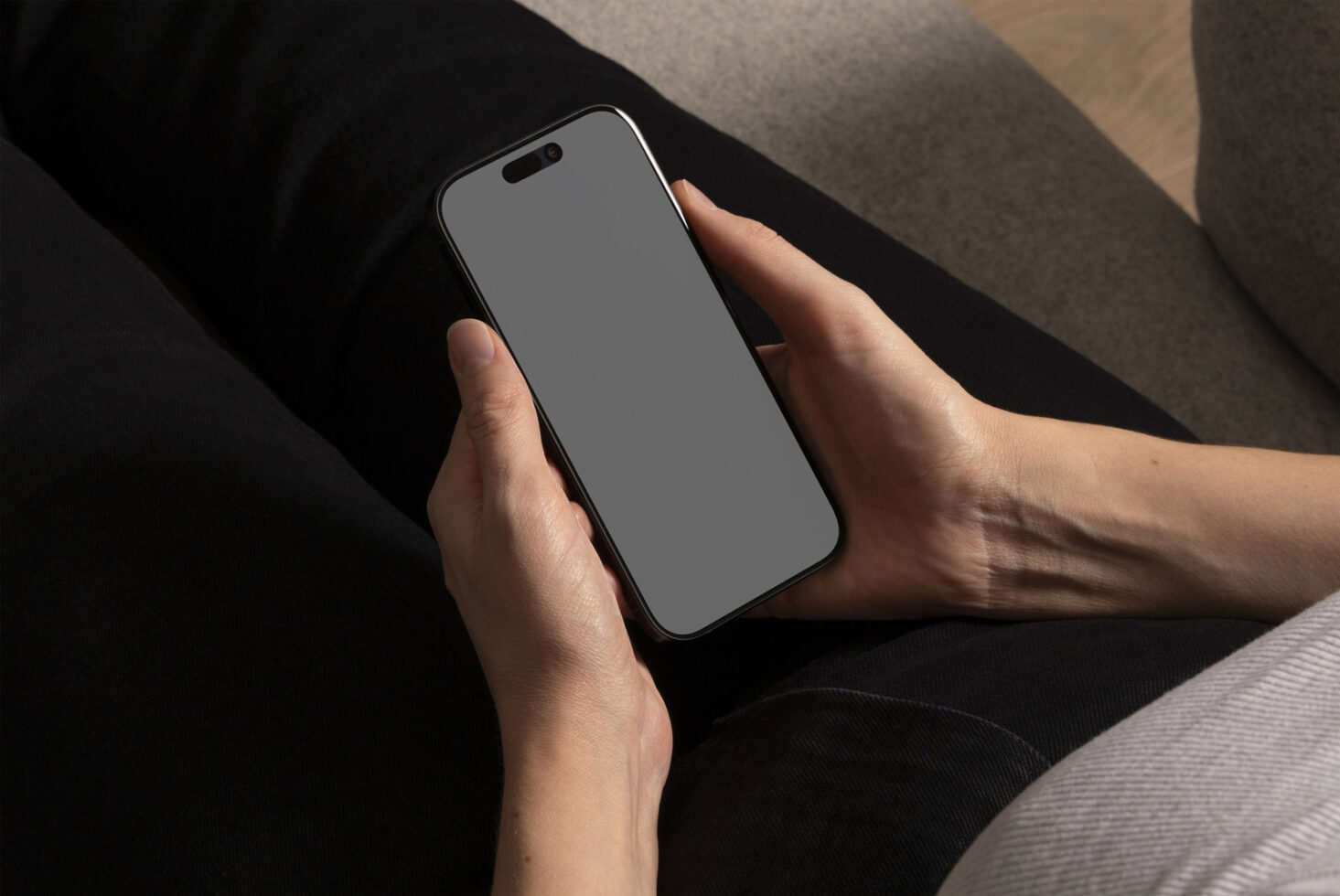 Mockup of a smartphone held in hands with blank screen suitable for design presentations UX UI projects showcasing apps. Ideal for designers and templates.