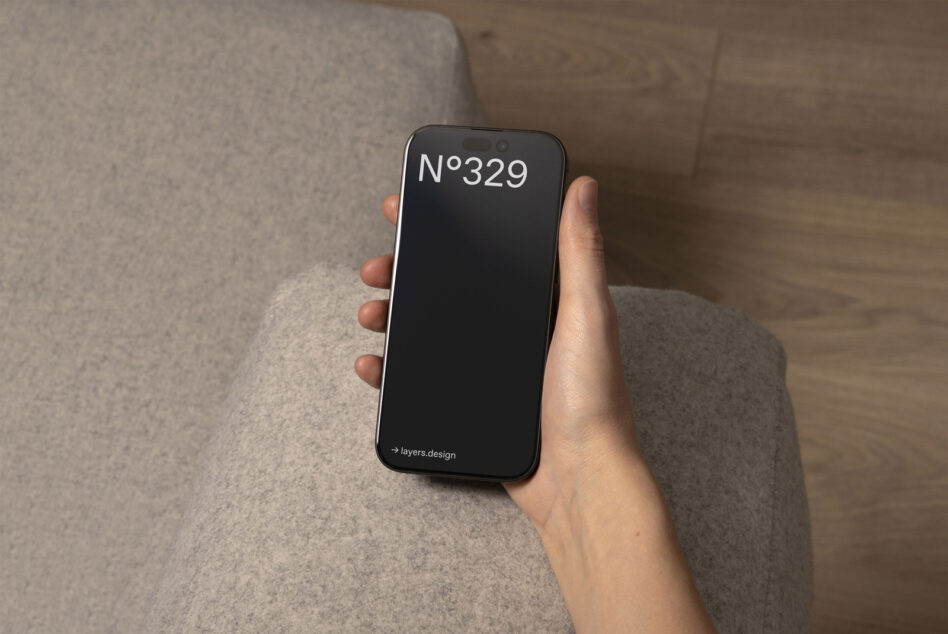 Hand holding iPhone with dark screen displaying N°329
