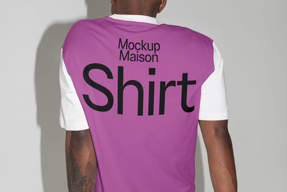 Back view of a mockup t-shirt with bold black text Mockup Maison Shirt in large font. Ideal for designers seeking stylish, customizable mockup templates.