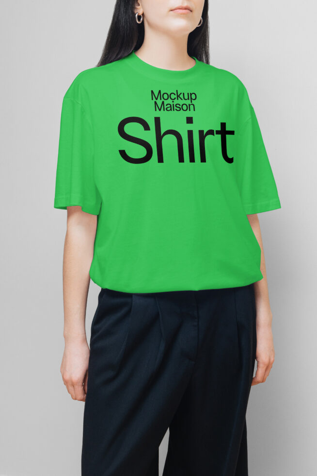 Green t-shirt mockup on model with black pants suitable for showcasing designs. Perfect for graphic designers and apparel template use in fashion projects.