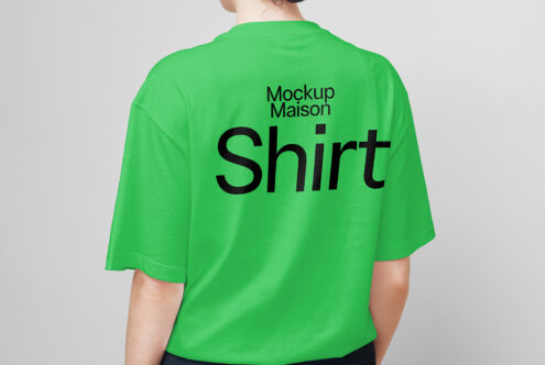 Green shirt mockup on person showcasing bold black text design on the back perfect for designers looking for apparel templates digital design resources.