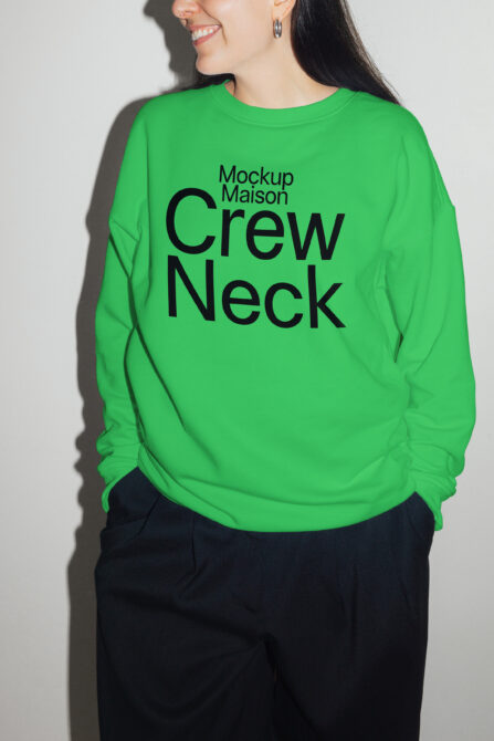 Green crew neck sweatshirt mockup featuring bold black text. Ideal for apparel design, branding, fashion templates. Perfect for graphic designers.