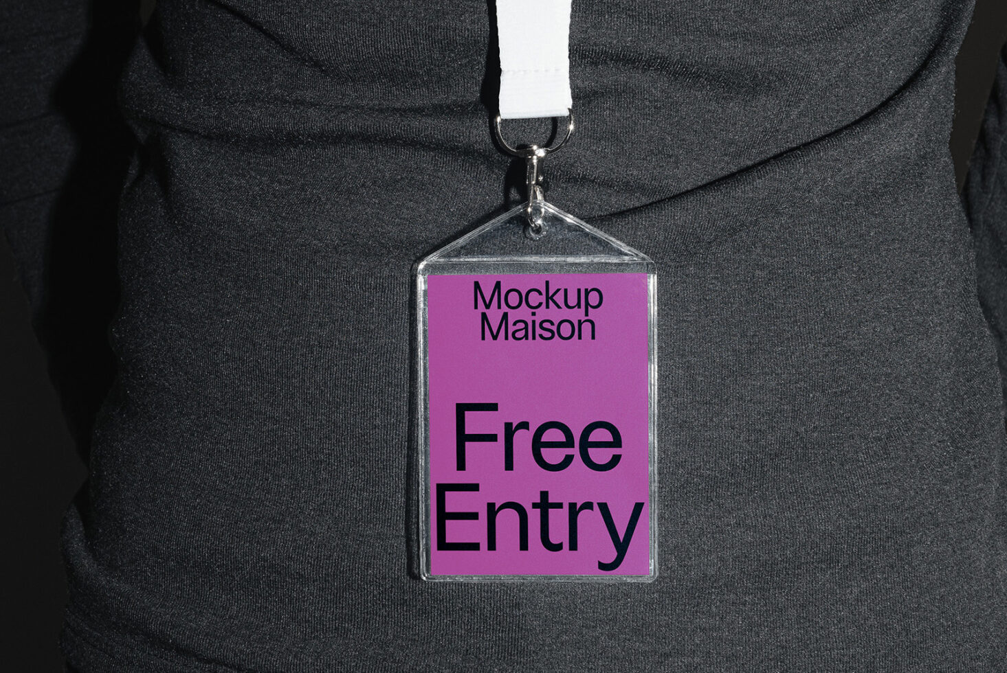 Close-up of a badge on a lanyard with Free Entry text for Mockup Maison. Ideal for graphic designers and branding projects. Badge design mockup template.