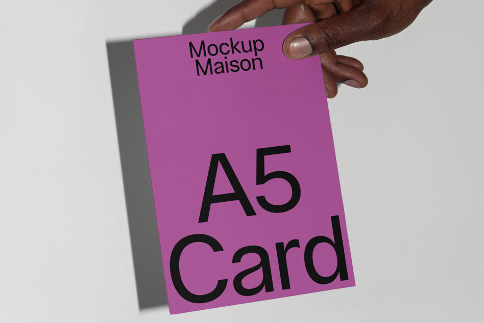 Hand holding a purple A5 card mockup for designers showcasing print design presentation branding templates stationery layout minimalist style.