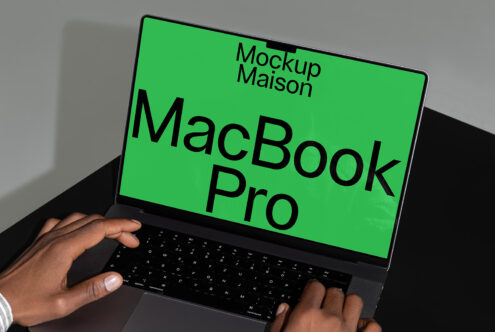 MacBook Pro mockup with green screen displayed on a desk. Perfect for designers seeking high-quality digital assets templates for creative projects.