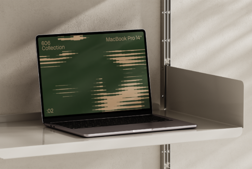 Mockup of a MacBook Pro 14 inch on a modern shelf displaying abstract graphics on screen. Ideal for showcasing digital designs. Laptop template for designers.