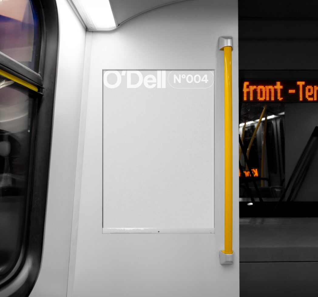 Subway poster mockup in a train interior with white panel and yellow pole; perfect for graphic designers creating realistic transport advertisements.