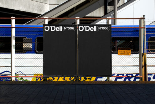 Railway station billboard mockup with two blank black panels for advertising display. Ideal for urban design projects. Keywords: mockup, billboard, urban.