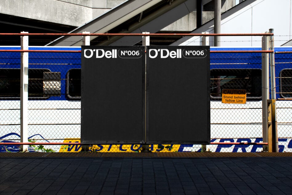 Two dark O'Dell billboards mounted at transit station platform