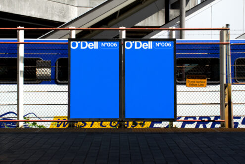 Blue poster mockup at a train station with clear branding space. Ideal for graphic designers seeking urban advertisement templates and design inspiration.