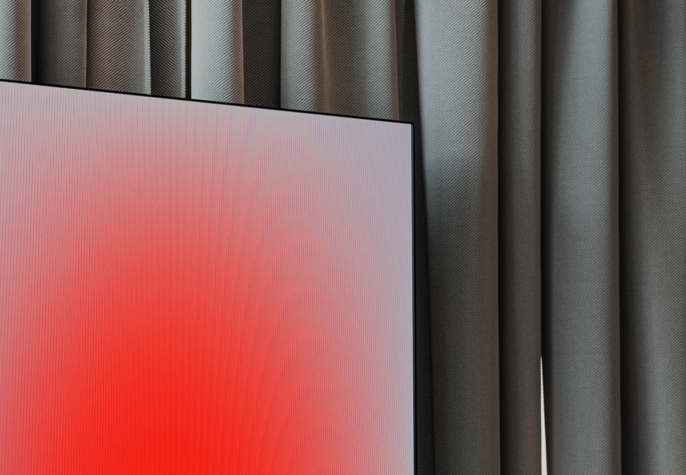 TV mockup with a red gradient screen displayed against a backdrop of dark curvy curtains. Perfect for design presentations and showcasing digital assets.