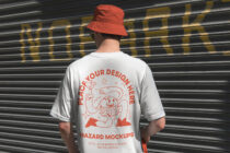 White tee with red monster print, red bucket hat worn by model from behind