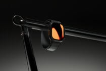 Smartwatch mockup with glowing orange gradient display on stand
