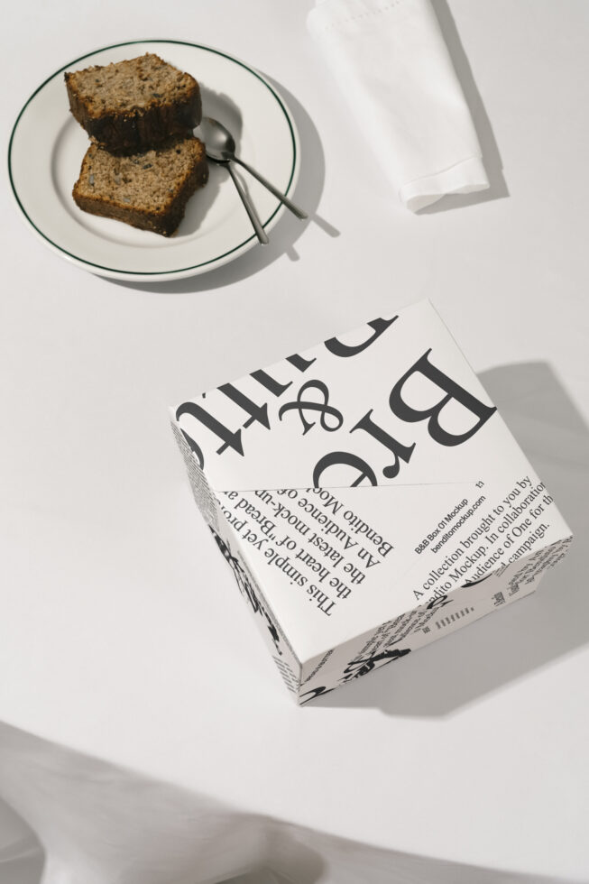 Typography packaging mockup with a plate of sliced bread and cutlery on a table. Ideal for graphic designers and template creators. Food presentation.