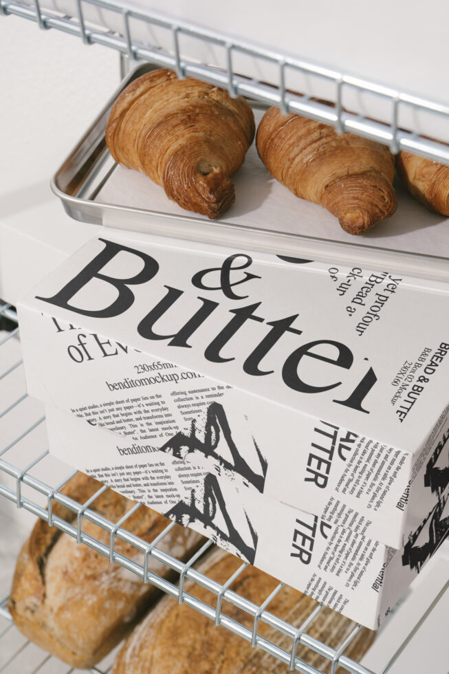 Bakery packaging mockup featuring croissants and bread on metal shelves. Ideal for designers seeking food-related templates and graphic design resources.