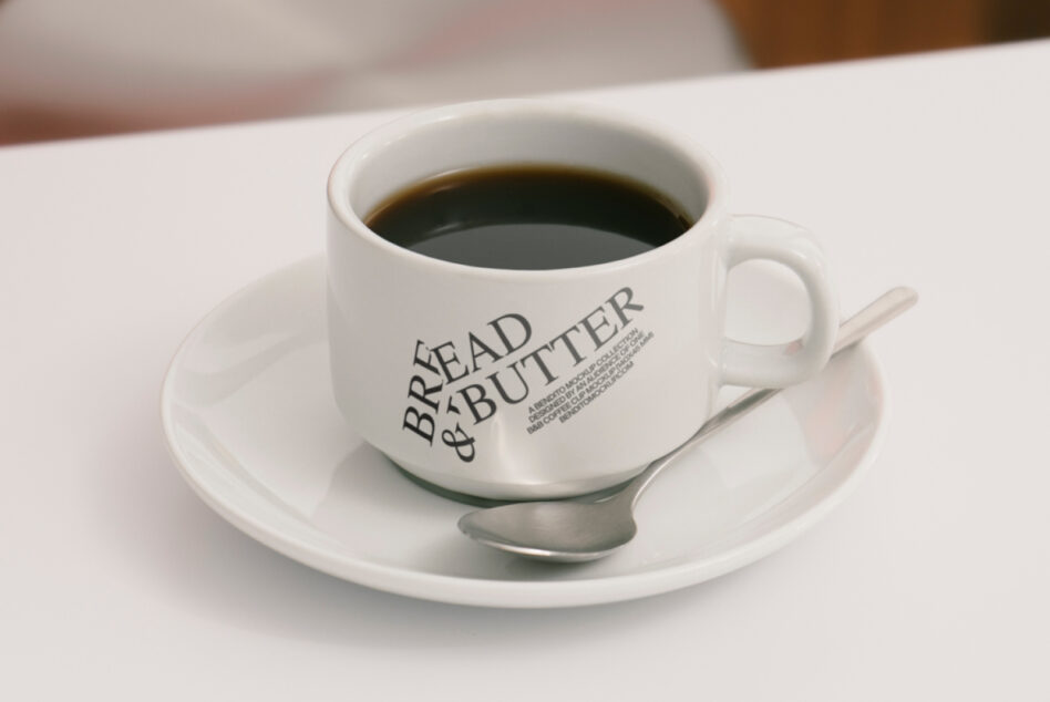 Coffee cup mockup with stylish typography design featuring Bread and Butter text Ideal for designers creating cafe branding or product presentations