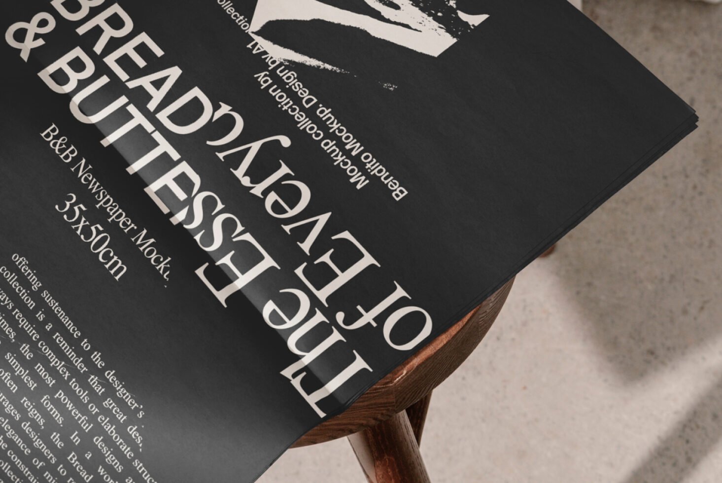 Newspaper mockup on wooden stool showcasing bold typography design. Ideal for graphic designers, perfect for template displays and print previews.