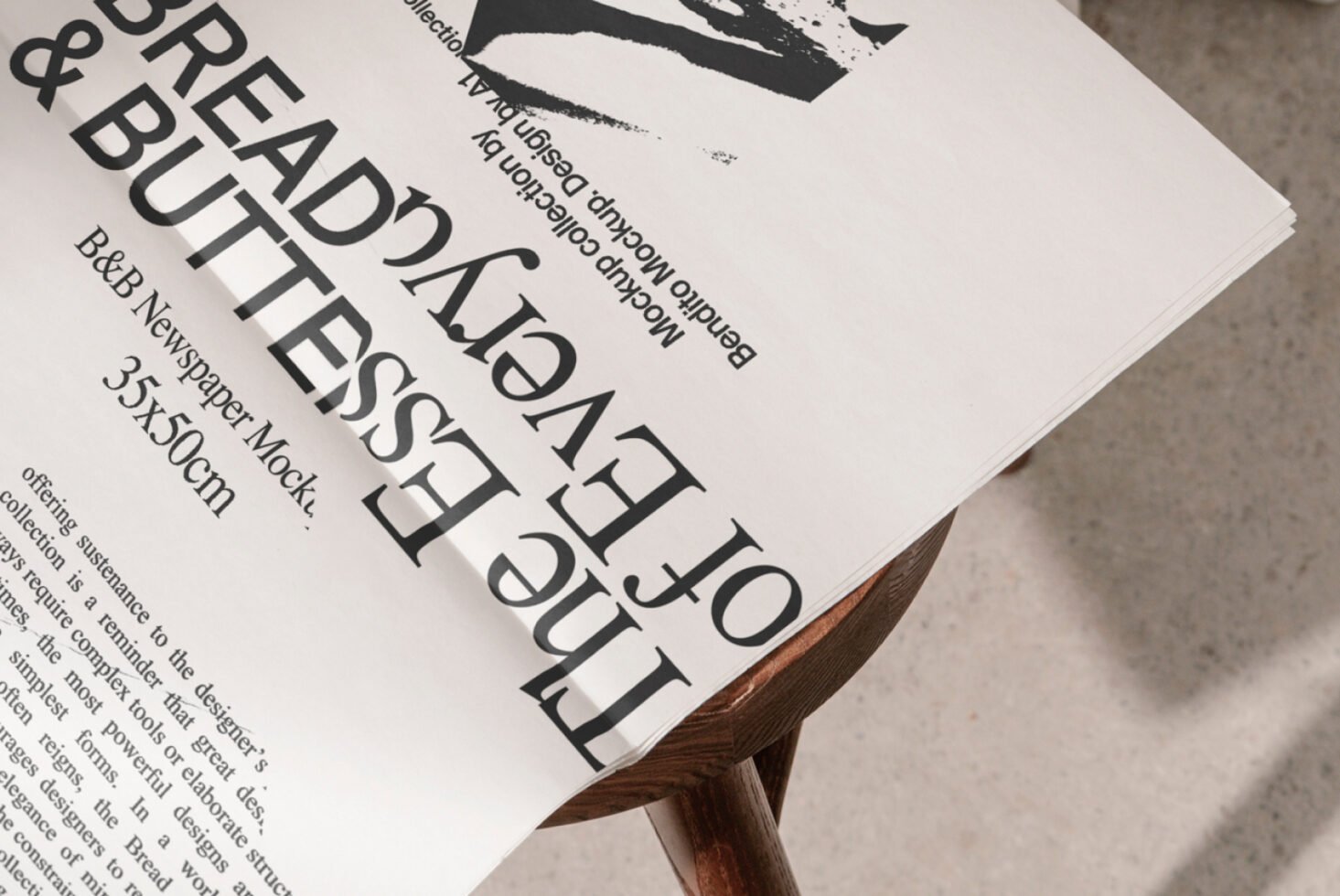 Minimalist newspaper mockup on a wooden stool showcasing bold typography perfect for design presentations and branding projects. Ideal for graphic designers.