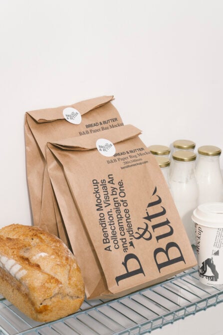 Kraft paper bag mockup with bread butter branding near fresh loaf