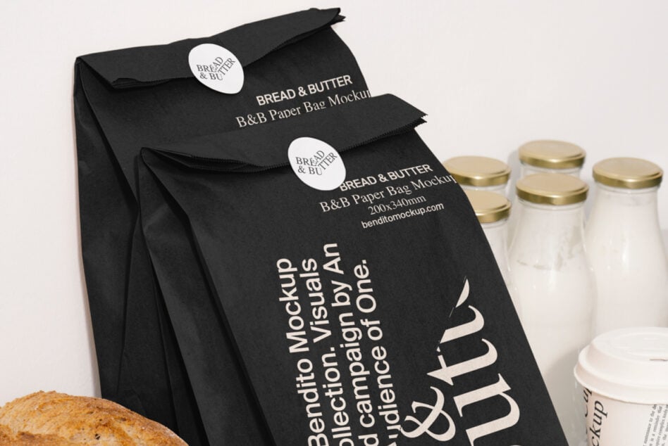 Black paper bags with Bread & Butter branding, white sticker seals, glass jars with gold lids