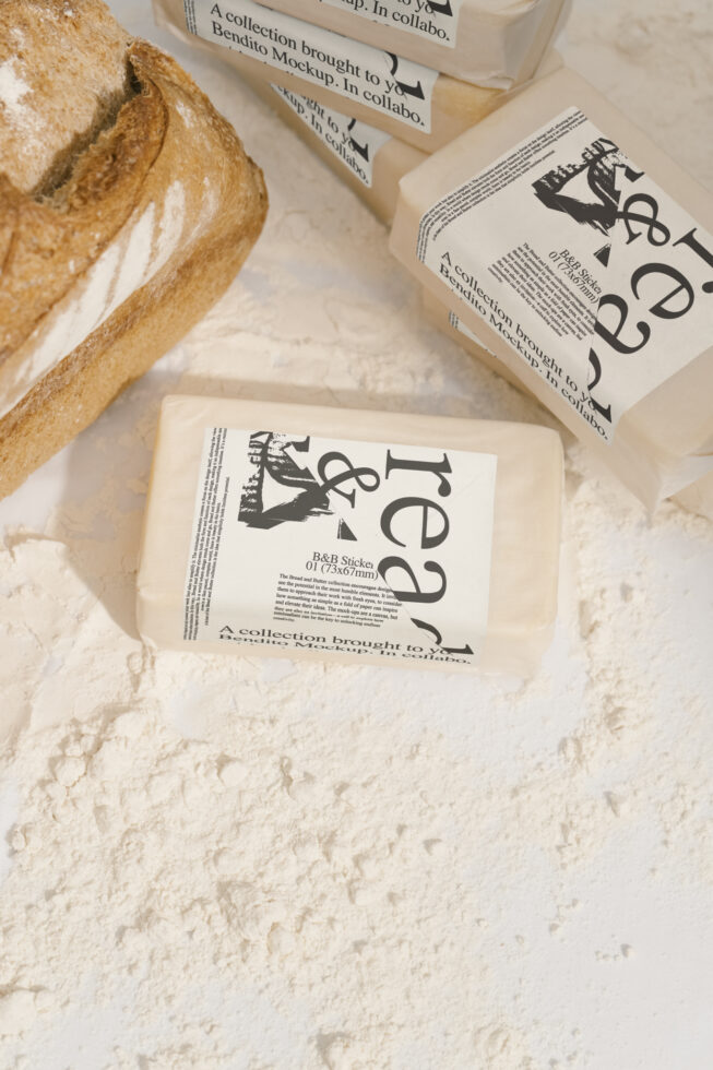 Creative packaging mockup featuring artisan bread and wrapped items on flour-dusted surface. Ideal for showcasing design templates for food branding.