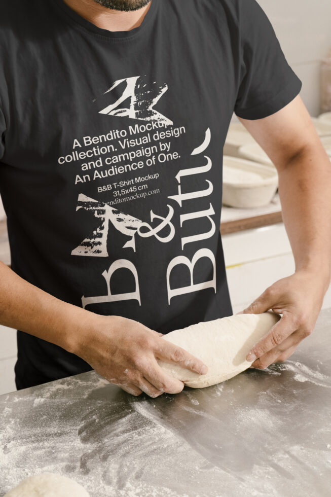 T-shirt mockup design featuring a baker kneading dough on a floured surface in a kitchen setting ideal for graphics and template designers.