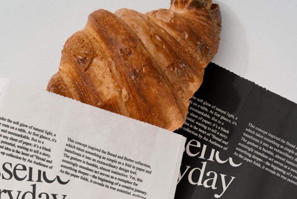 Croissant on angled pages showing body copy with serif text reading everyday