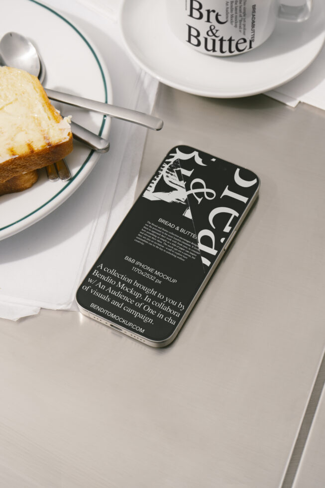 iPhone mockup on a table beside a cup and buttered toast, showcasing design layout for digital assets, ideal for graphic designers and creatives.