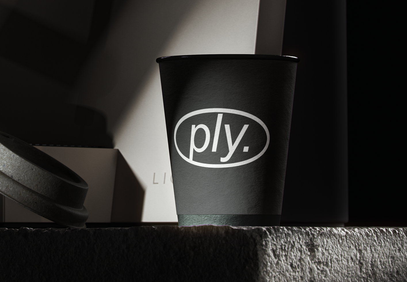 Black paper cup with the word ply stylishly printed on it. Ideal for branding mockups or product design templates. Shadow and light contrast.