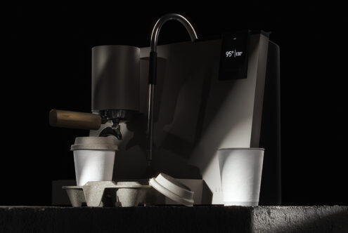 Sleek espresso machine with wooden handle and digital display, paired with eco-friendly paper cups. Perfect for modern kitchen mockups and graphic designs.