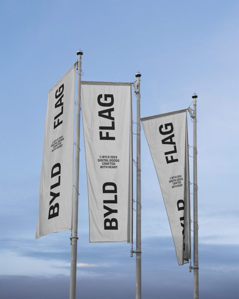 Three vertical flags with bold text BYLD FLAG against a clear sky. Suitable for mockups and graphic templates. Perfect for digital designers.