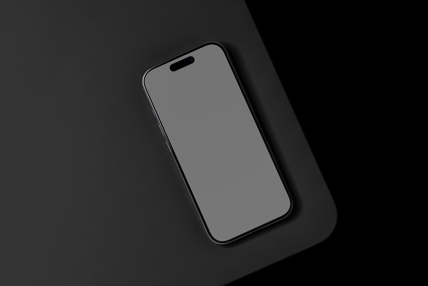 Minimalist smartphone mockup on dark background perfect for designers. Ideal for showcasing mobile app interfaces templates or graphics in a professional way.