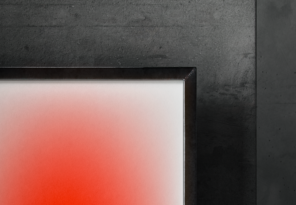 Modern mockup showcasing an abstract art print with a red gradient in a sleek black frame against a concrete wall ideal for graphic design presentations.