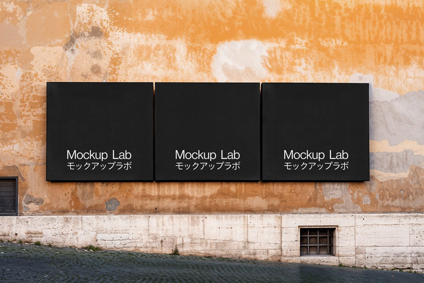 Row of three black square signs on aged rusty concrete wall
