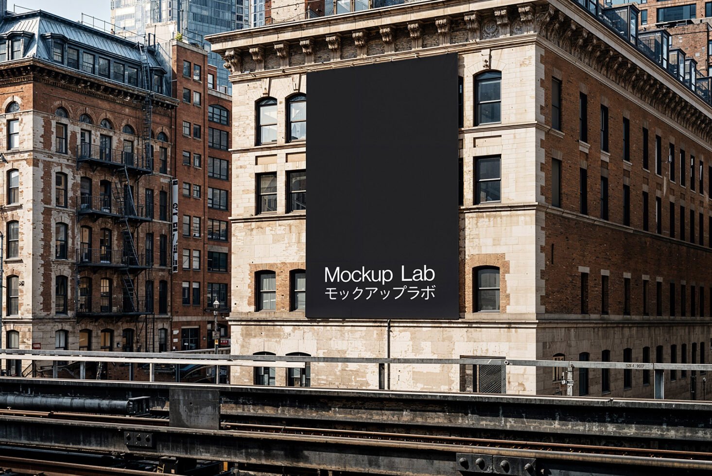 Urban building facade with large blank banner for Mockup Lab. Ideal for graphic design mockups or templates. Architectural design reference.