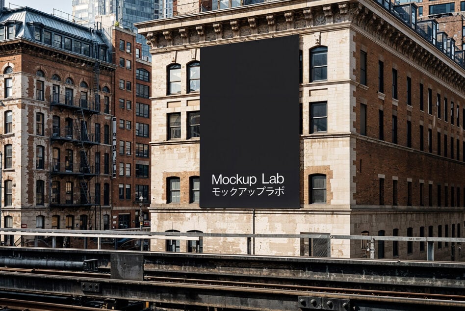 Urban building facade with large blank banner for Mockup Lab. Ideal for graphic design mockups or templates. Architectural design reference.