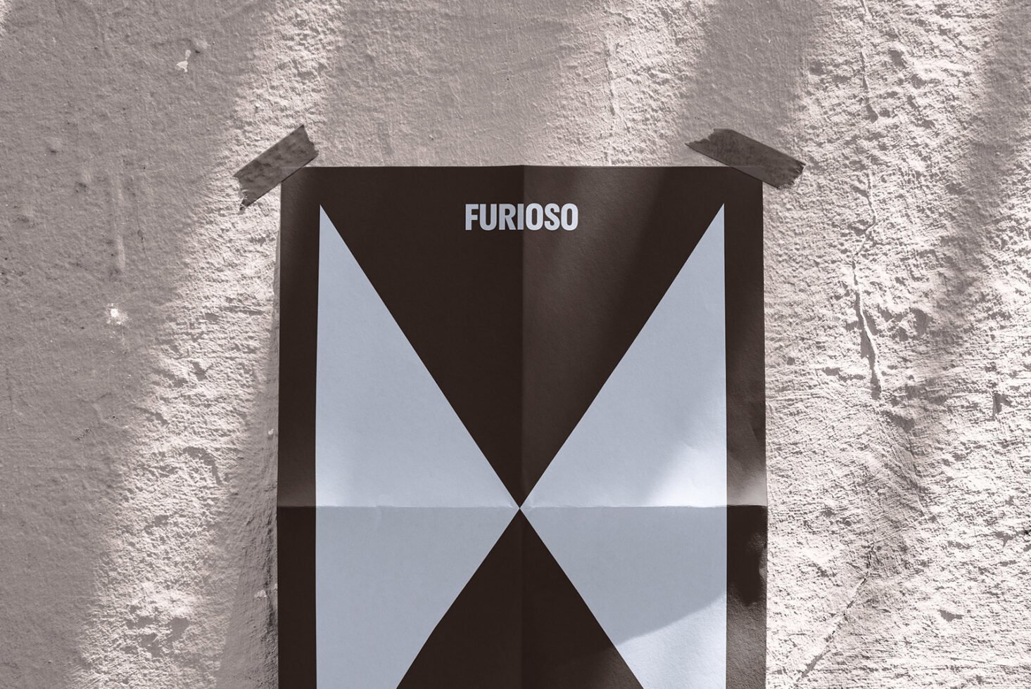 Mockup of a geometric poster with bold black and white patterns taped to a textured wall. Perfect for showcasing modern graphic design templates.