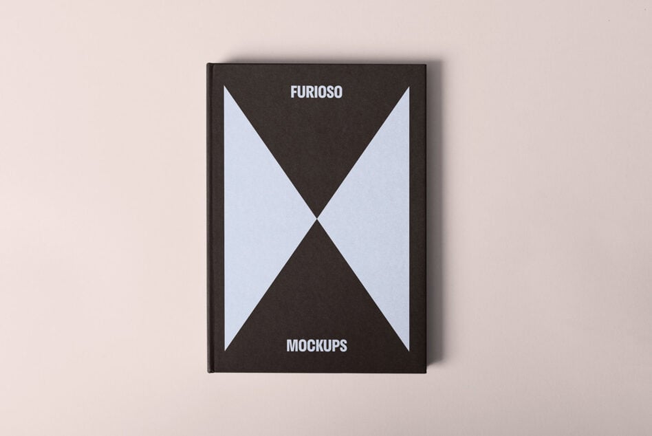 Book mockup with minimalist black and white geometric cover. Suitable for designers seeking elegant mockup templates for branding and presentation.
