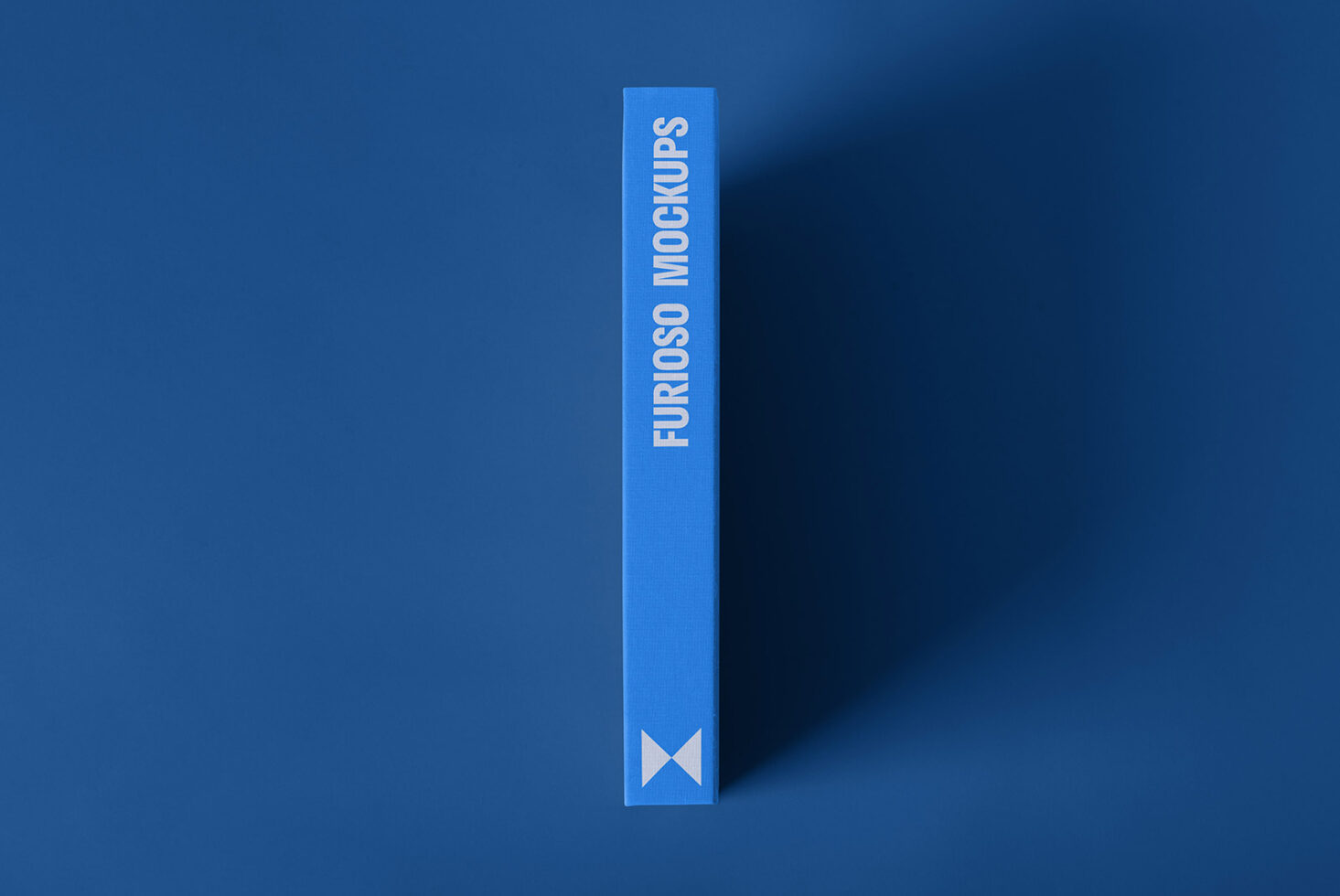 Minimalistic blue book mockup cover featuring bold text Furioso Mockups perfect for showcasing designs templates and graphics in a professional presentation