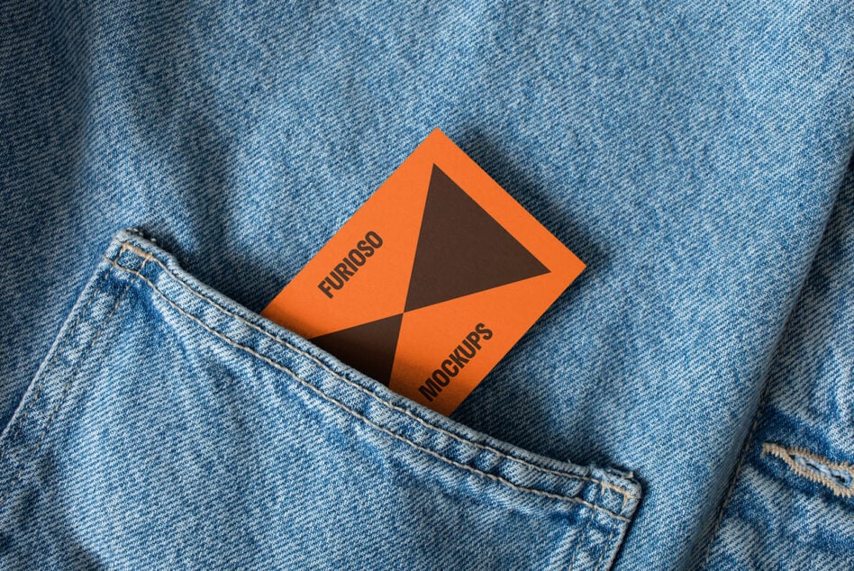 Orange business card mockup in blue denim pocket angled for creative design. Ideal for branding presentation. Graphic design resource for designers.