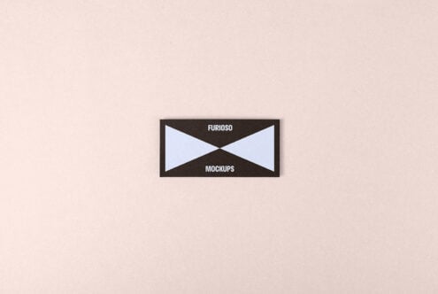Minimal business card mockup on beige background ideal for designers. Black and blue color scheme with modern typography enhancing brand presentation.