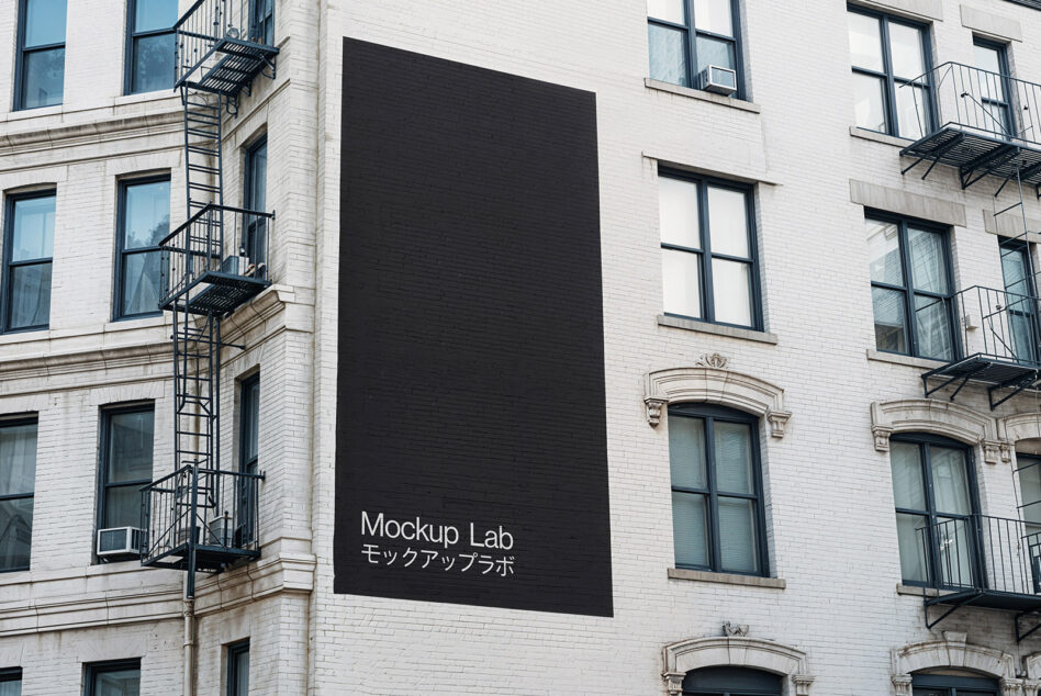 Dark billboard mockup on brick building showing Mockup Lab branding