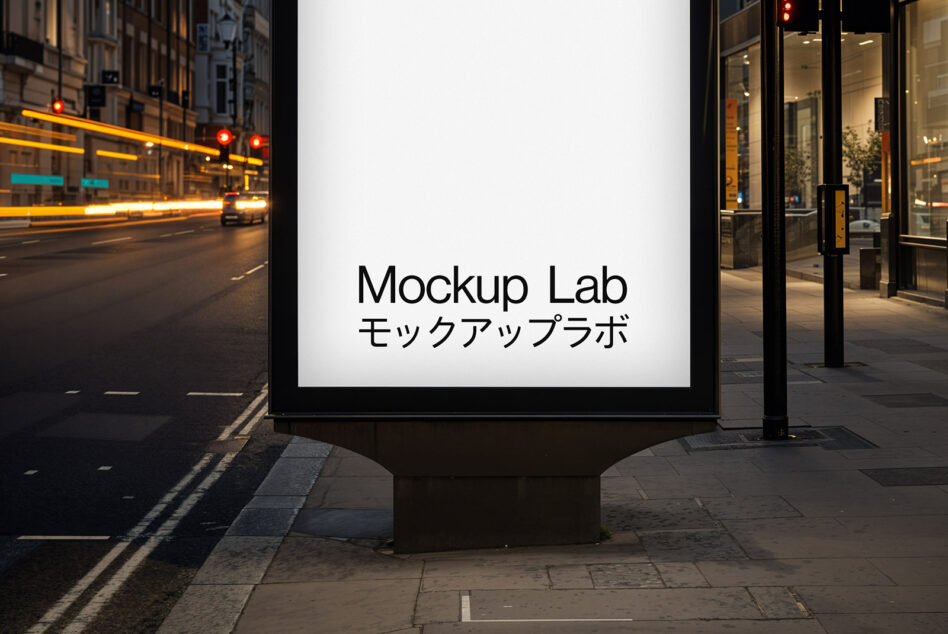 Street billboard mockup on downtown corner at evening with storefront glow