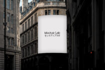 Blank curved billboard mounted on historic stone architecture in daylight