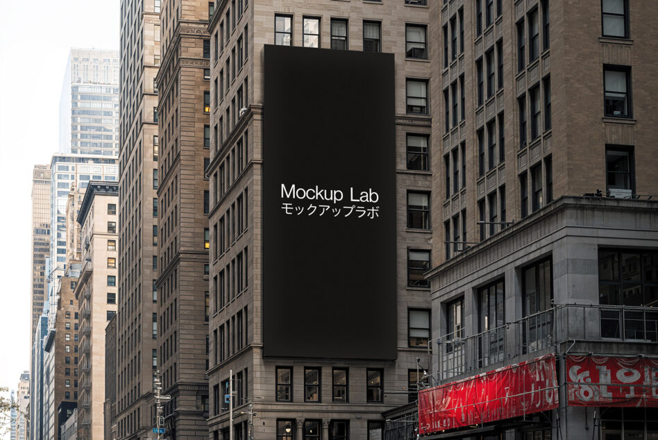 Tall building billboard mockup with black background between historic downtown structures