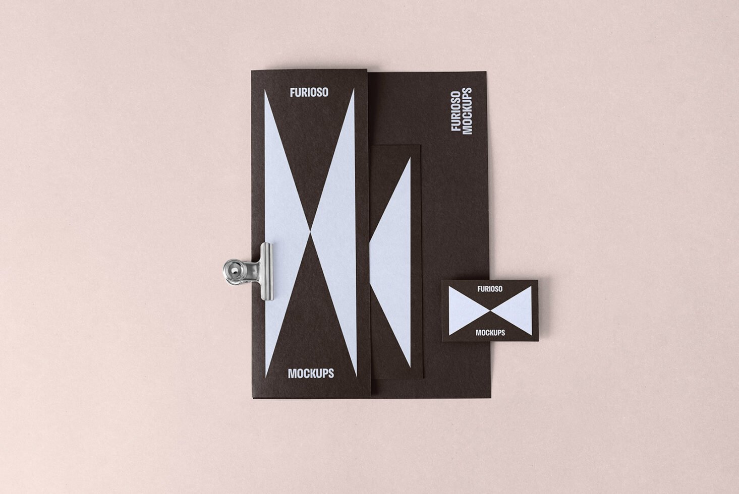 Stylish stationery branding mockup set with a minimalistic design template featuring blue geometric shapes on dark paper. Perfect for design presentations.