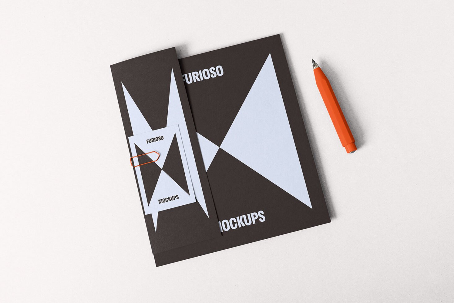 Minimalist mockup design featuring black and white geometric shapes on brochures with orange pen ideal for graphic designers and branding presentations.