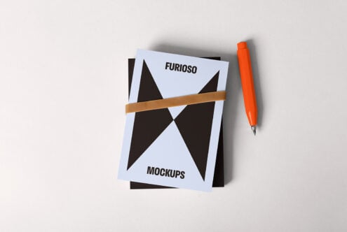 Minimalist mockup design featuring a card with geometric patterns and text Furioso Mockups next to an orange pen perfect for graphic designers.