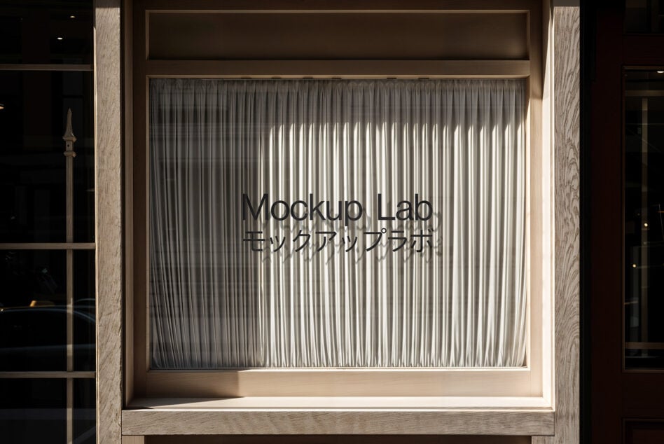 Storefront window mockup featuring Mockup Lab text with curtains behind glass Keywords: mockup storefront signage branding design asset curtains window