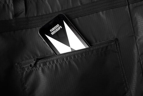 Smartphone mockup in black textured pocket with white abstract design visible. Ideal for designers seeking modern presentation templates.